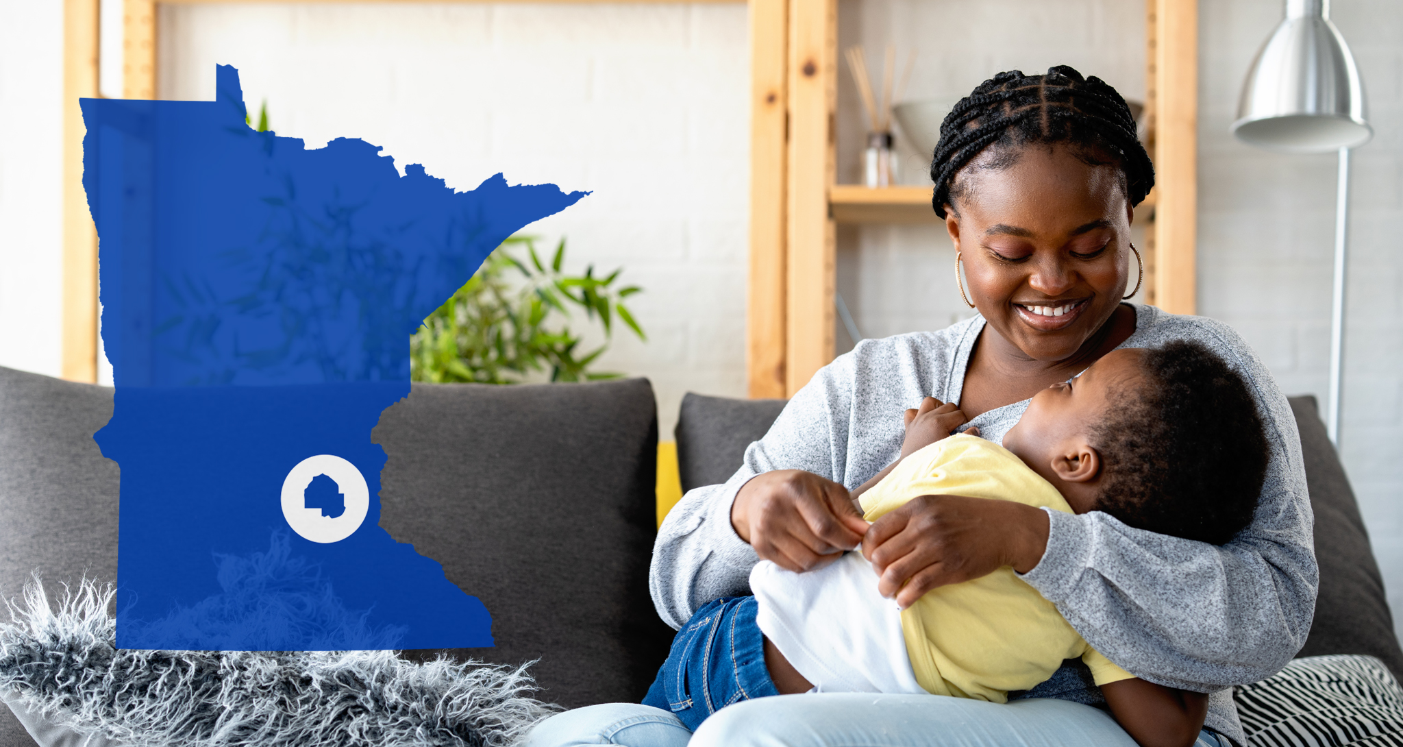 Mother holding child with Minnesota state outilne overlayed