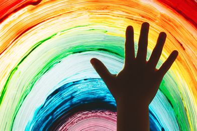 Raised hand and a rainbow