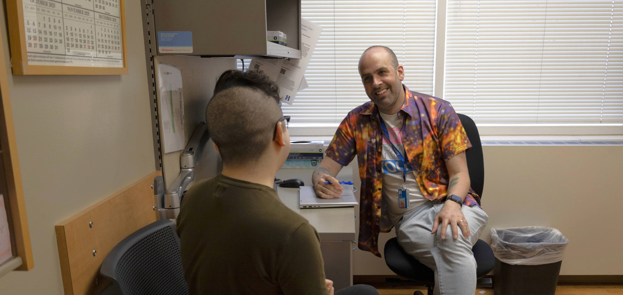 Paul and patient in an exam room. 