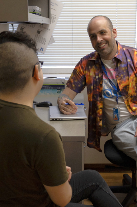 Paul and patient in an exam room. 