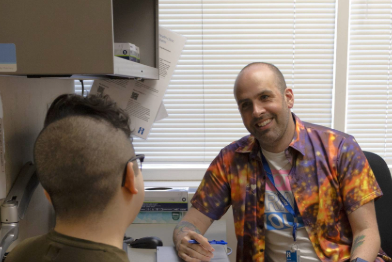 Paul and patient in an exam room. 