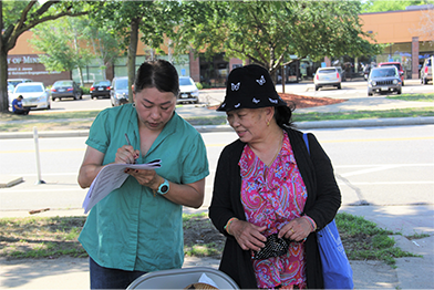 Two people talking outside
