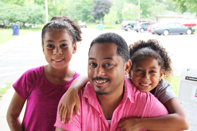 Picture of a family whose two daughters have taken swim lessons through Make a Splash