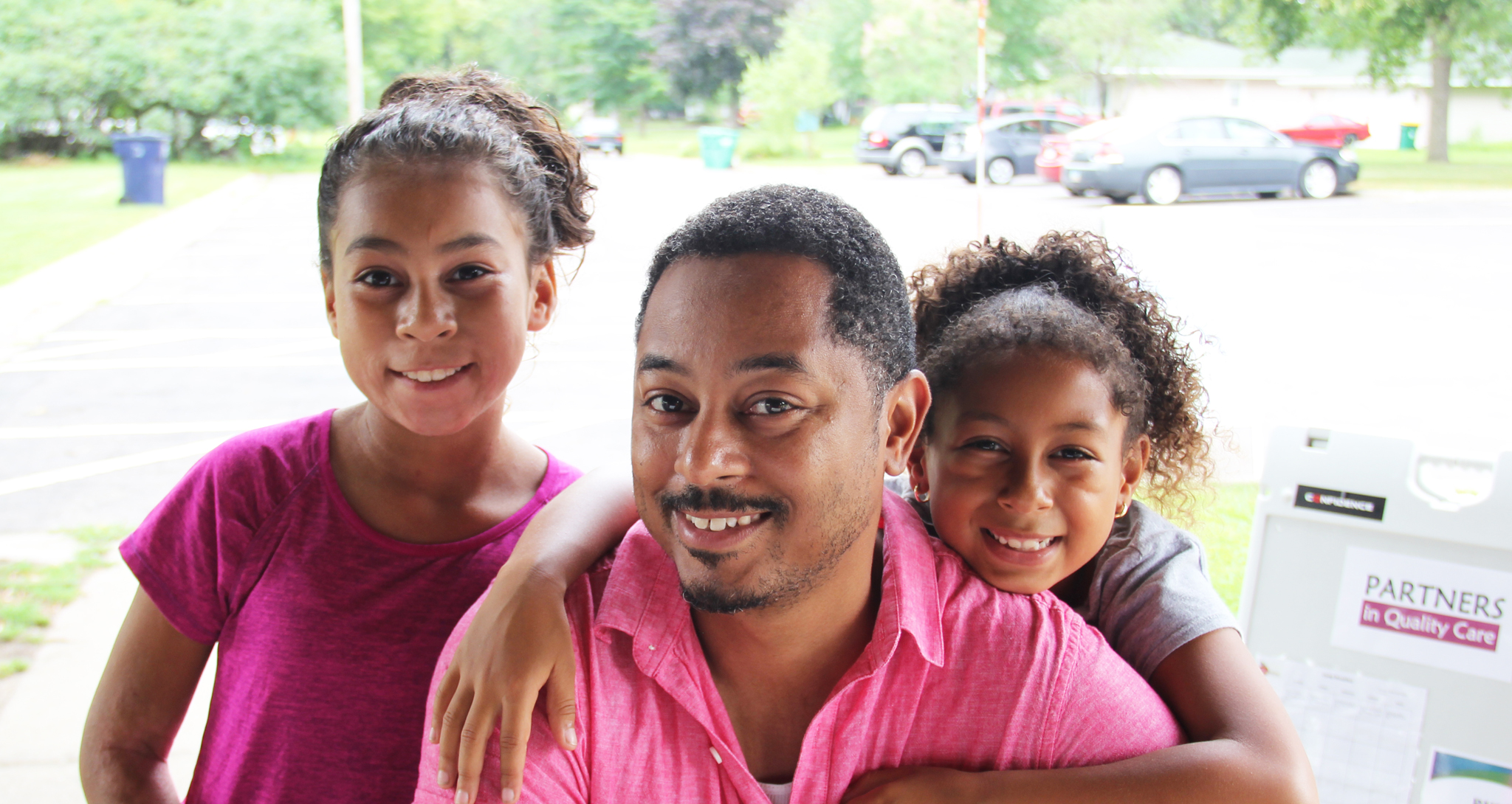 Picture of a family whose two daughters took swim lessons through Make a Splash