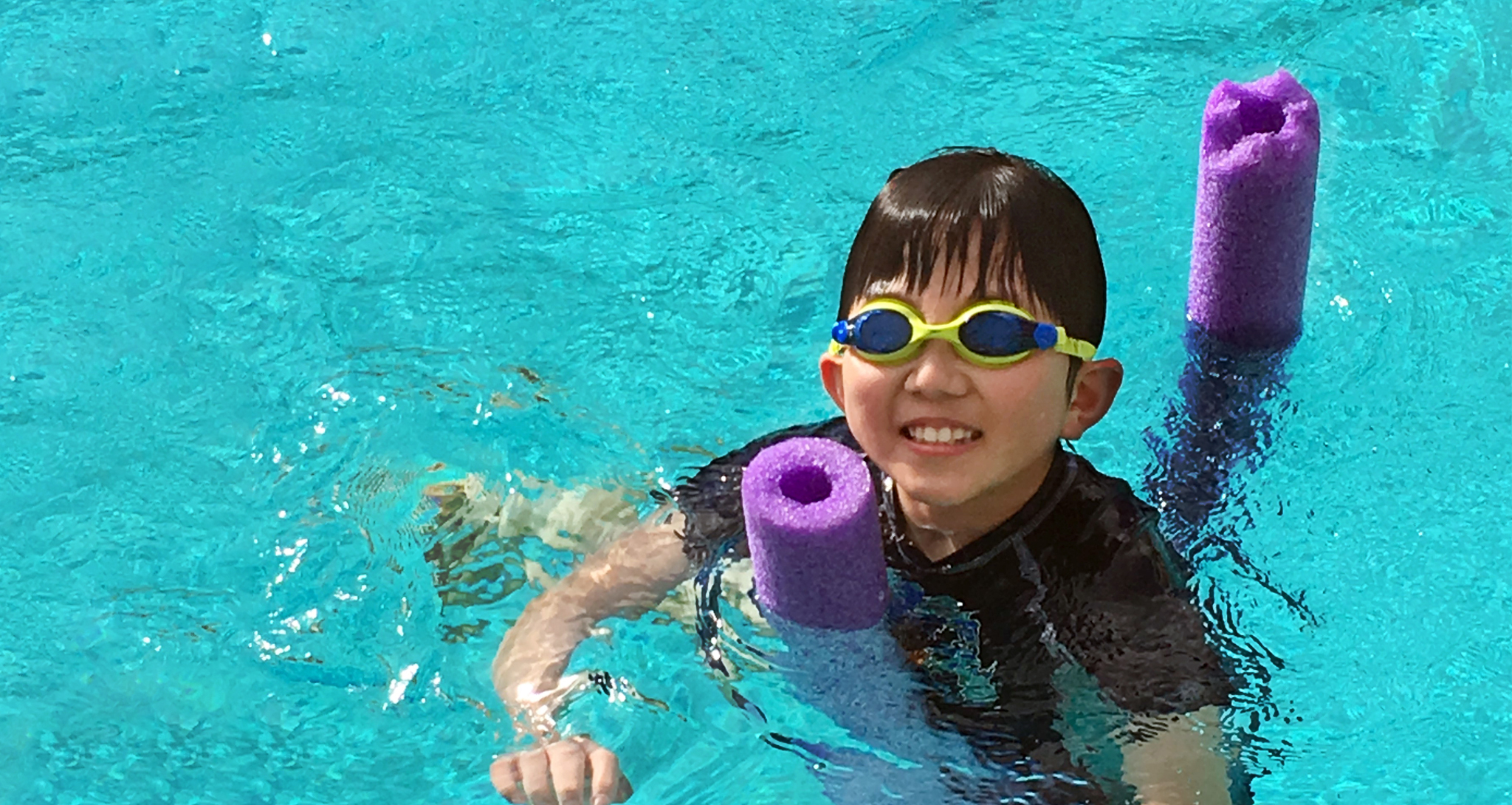 Boy swimming in a pool