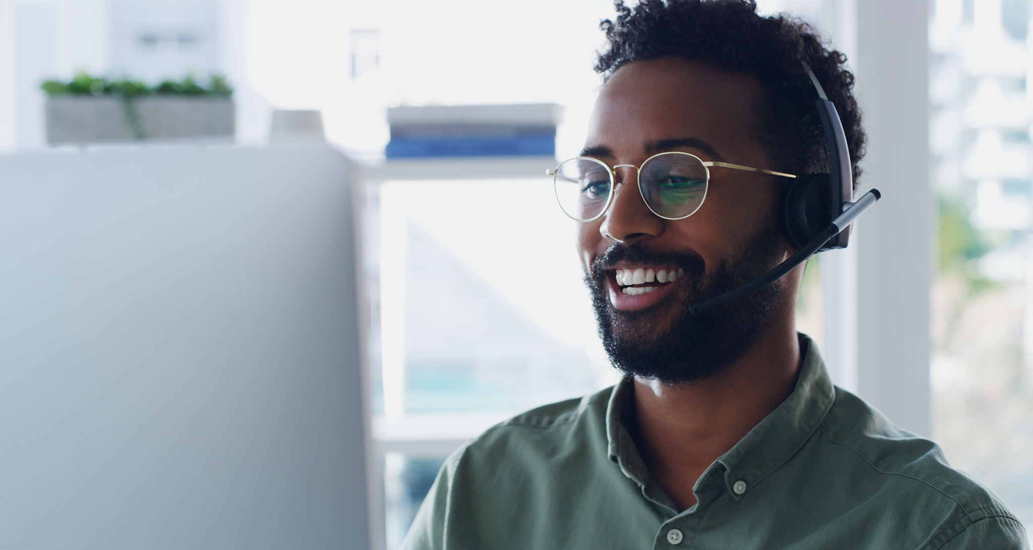 Man taking call from computer