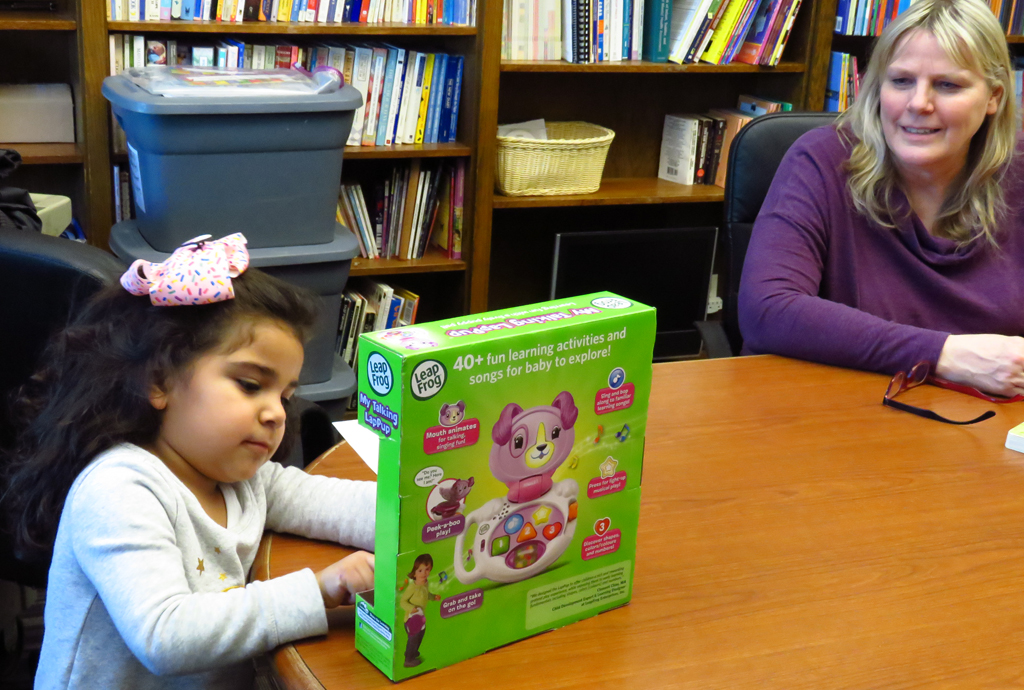 Sophia playing while Debbie, the director of Baby Space, looks on