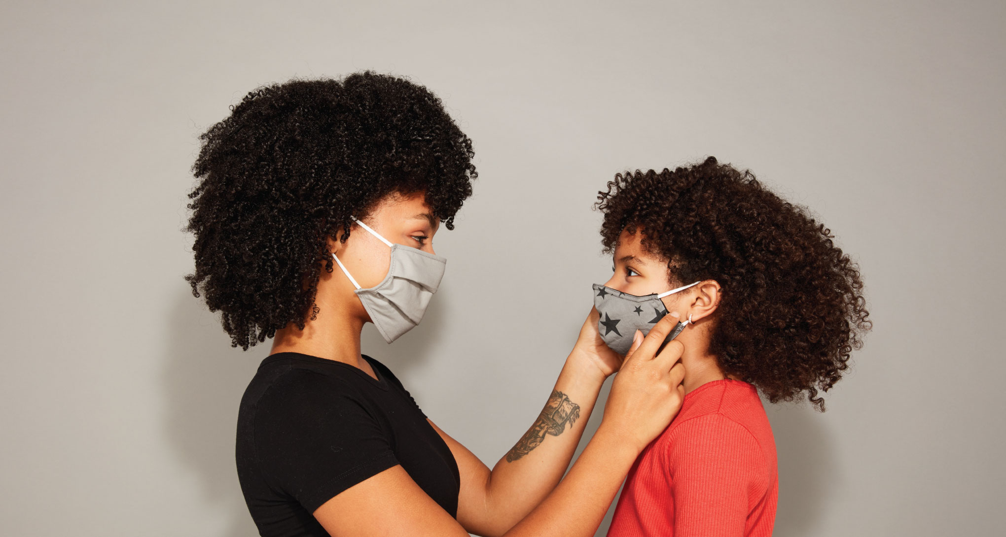 Two people wearing a mask