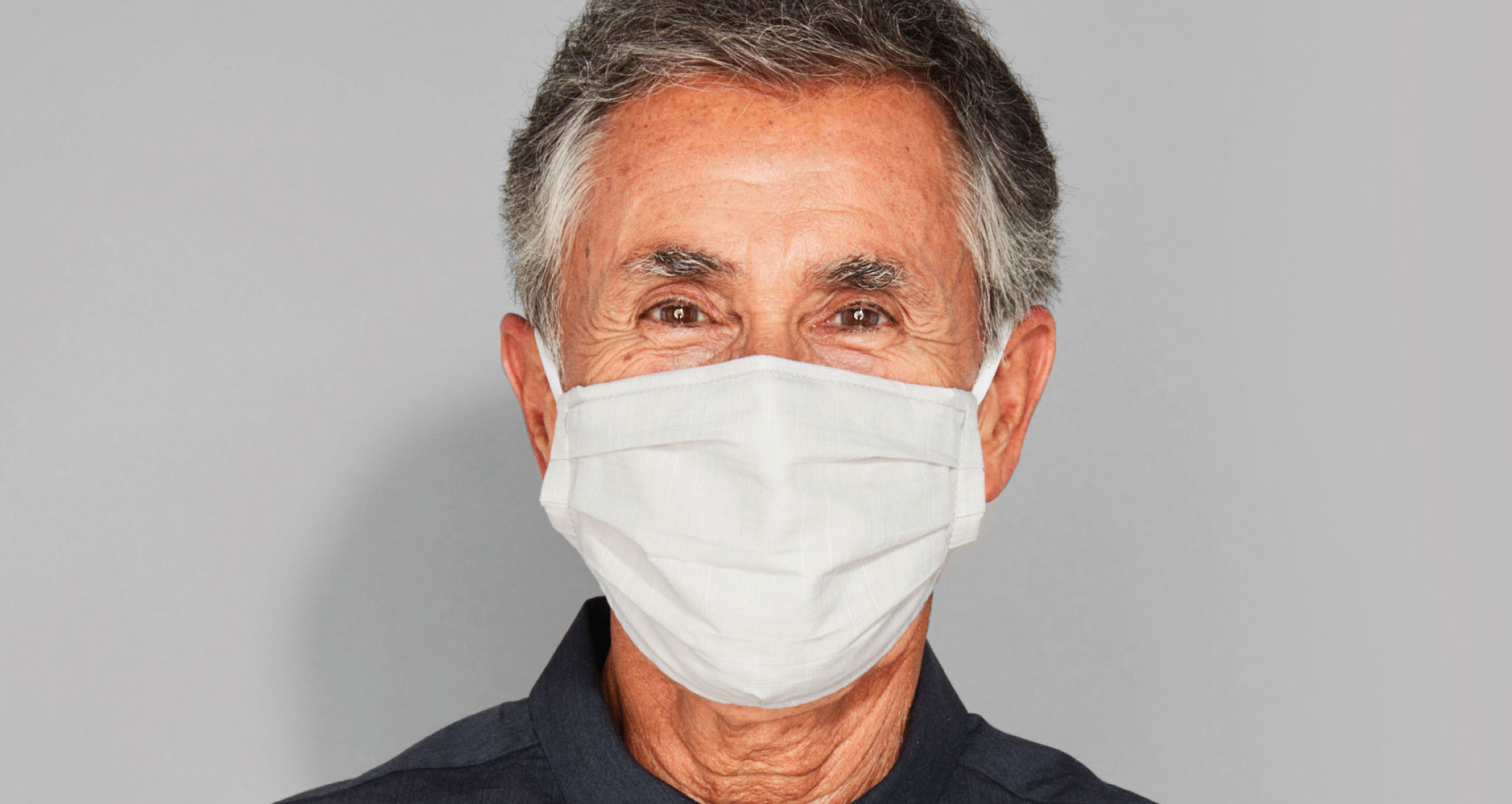 Older man wearing a mask