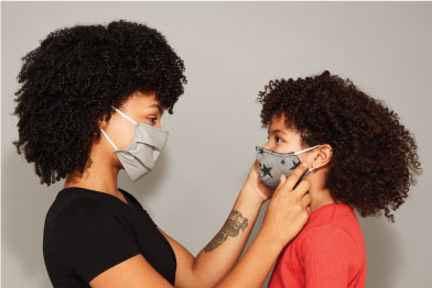 Mother and daughter wearing a mask