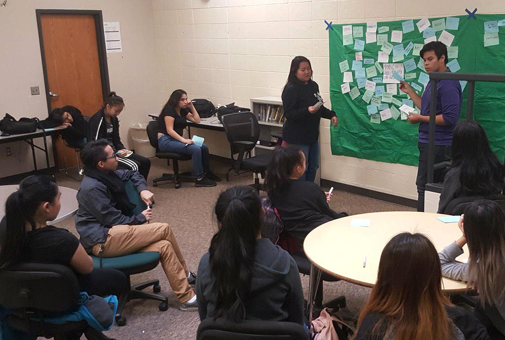 A group of teens receiving a class from teens participating in Brooklyn Center High School's Expect Respect Internship