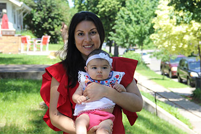 Avra holding her daughter